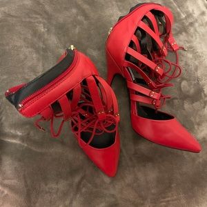 Red—-Steven Madden high heel shoe in size 7.